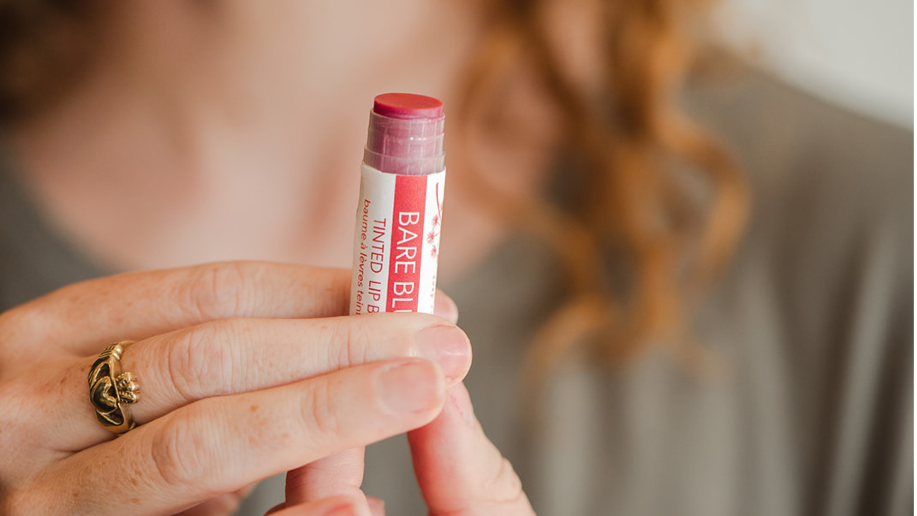 Wild Prairie Soap Company lip balm beside simple ingredients used in lip care