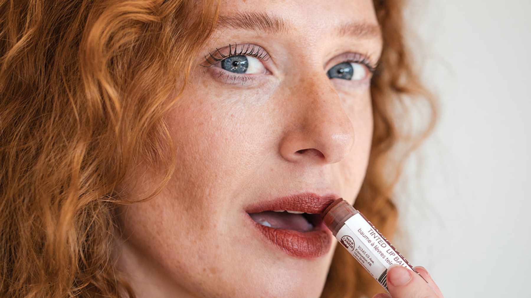 Natural tinted lip balms from Wild Prairie Soap Co. in soft pink and red shades, providing sheer colour and moisturizing lip care